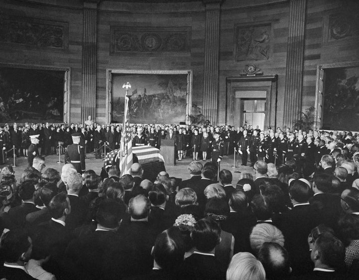 President Richard Nixon, center, speaks from a podium in front of the casket of Dwight Eisenhower in the Capitol Rotunda in Washington in March 1969.