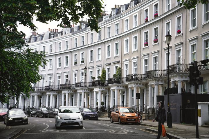 West London, England, UK – 06/10/2024: Street view. Pedestrians are walking on street.