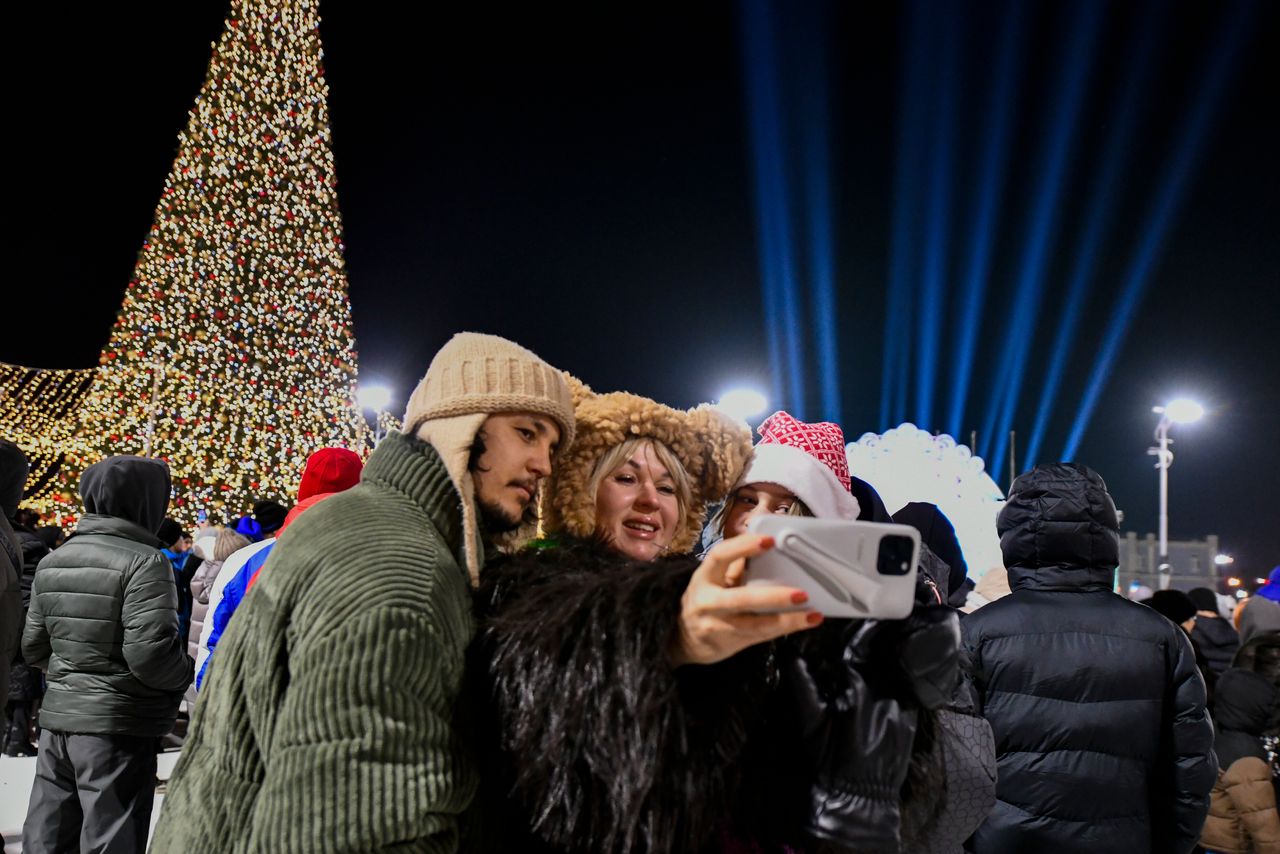 People make a selfie as they gather in the center of the Russian far east port Vladivostok, Russia, Tuesday, Dec. 31, 2024, to celebrate the new year. (AP Photo)