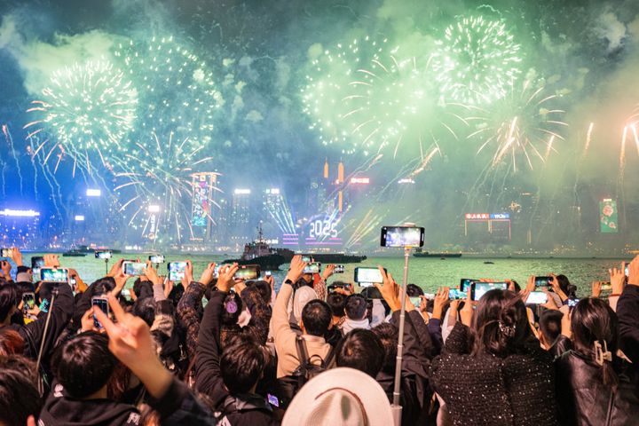 Fireworks light up the sky during the New Year celebrations in Hong Kong, China on December 31, 2024. (Photo by Man Hei Leung/Anadolu via Getty Images)