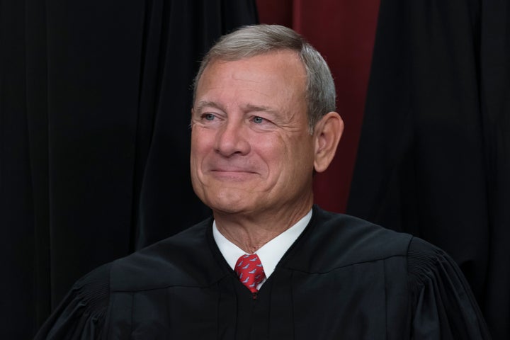 Chief Justice of the United States John Roberts joins other members of the Supreme Court as they pose for a new group portrait, at the Supreme Court building in Washington, Oct. 7, 2022. (AP Photo/J. Scott Applewhite, File)