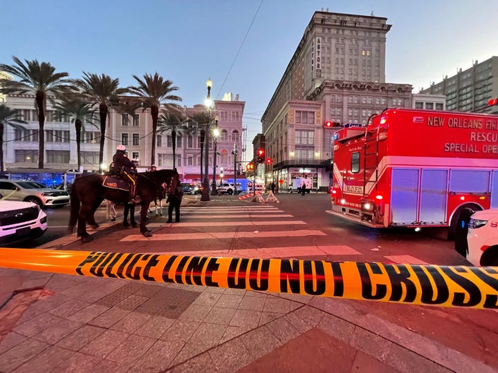 Police cordon off the intersection of Canal Street and Bourbon Street in the French Quarter of New Orleans.
