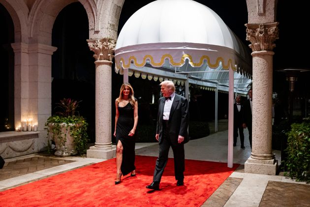 Donald and Melania Trump arrive at his Mar-a-Lago club on New Year's Eve.