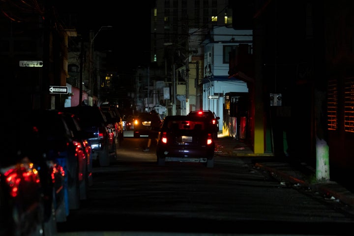 A street is dark during a blackout in San Juan, Puerto Rico, after sunset on Tuesday, Dec. 31, 2024. (AP Photo/Alejandro Granadillo)