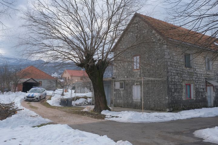 A view of a police vehicle at the home of a gunman after a shooting incident, in Cetinje, 36 kilometers (22 miles) west of Podogrica, Montenegro, on Jan. 2, 2025.