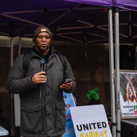 The author speaking at a political rally.