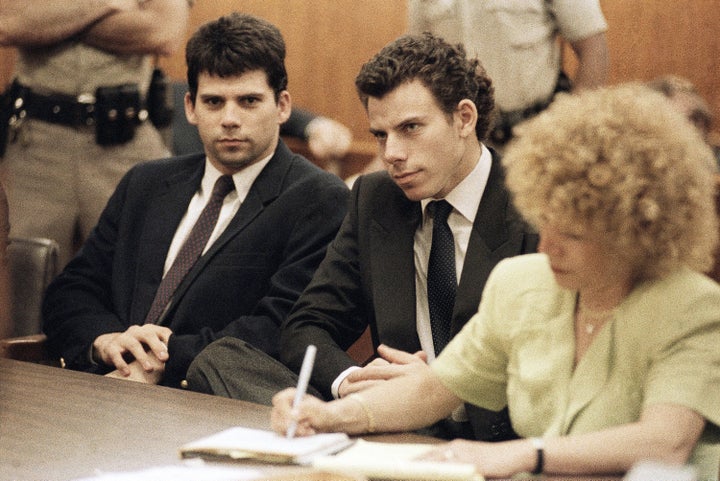 Lyle Menendez and Erik Menendez sit in Beverly Hills, Calif., courtroom, May 14, 1990 as a judge postponed their preliminary hearing on charges of murdering their wealthy parents. (AP Photo/Kevork Djansezian)