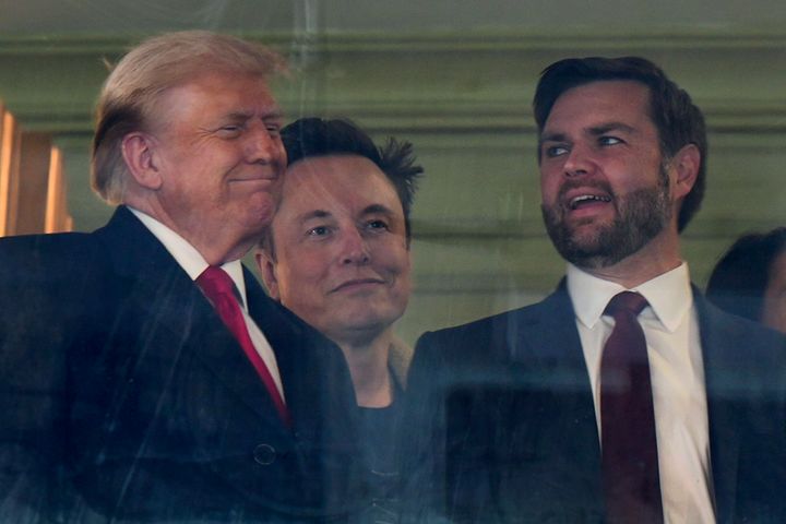 In this photo taken through a window, President-elect Donald Trump, Trump's nominee for Government Effectiveness, Elon Musk, and Vice President-elect JD Vance attend the NCAA college football game between Army and Navy at Northwest Stadium in Landover, Maryland. I'm doing it. , Saturday, December 14, 2024. (AP Photo/Stephanie Scarbrough)