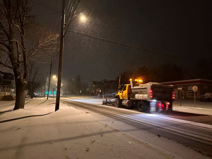 A snowplow passes through Lowville, New York, on Saturday, Jan. 4, 2025. (AP Photo/Cara Anna)