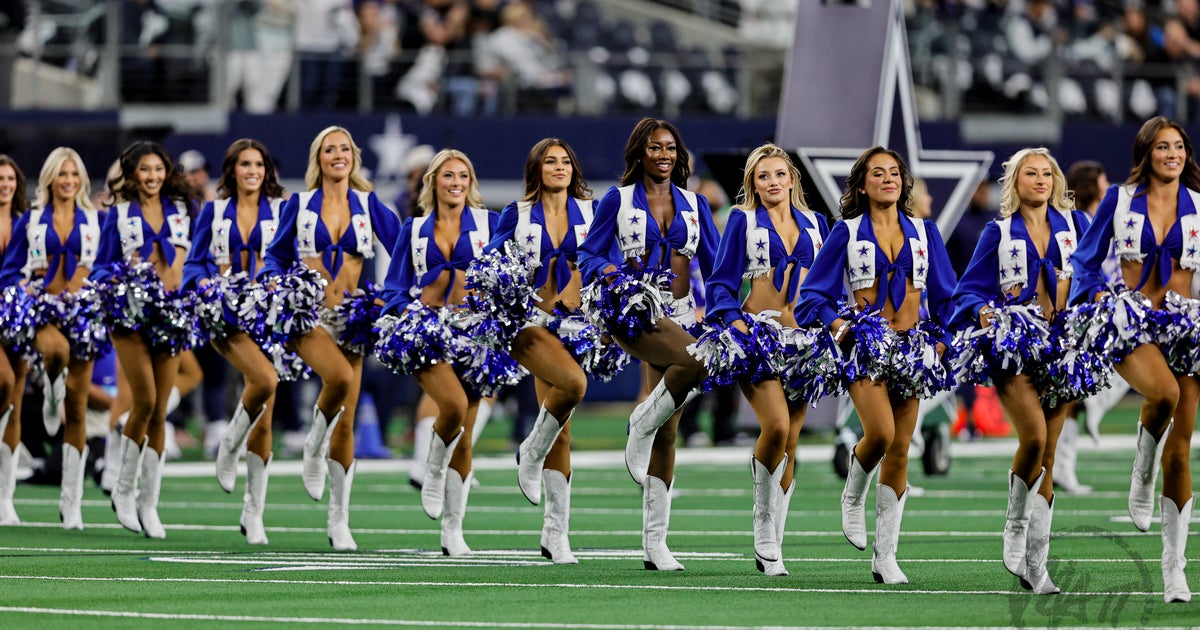 NextImg:Dallas Cowboys Cheerleader Gets Knocked Down By Football During Kickoff