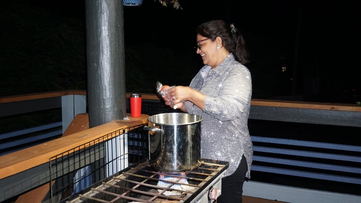 Emma Morales cooks asopao de camarones without power.