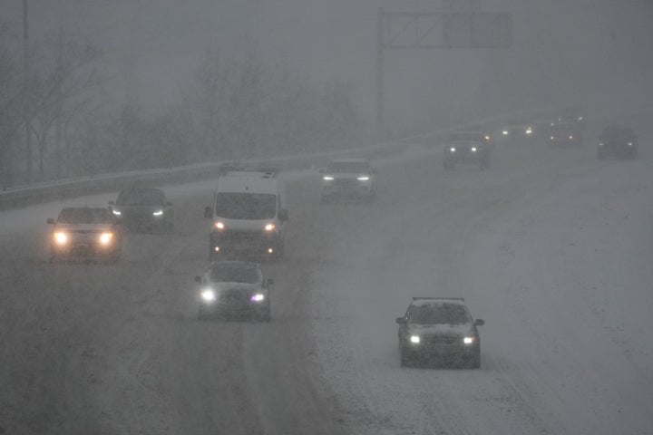 Vehicles drive along a highway during a winter storm on Jan. 5, 2025, in Cincinnati.