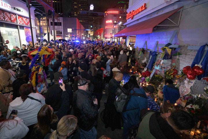 People crowd Bourbon Street near the intersection of Canal Street in New Orleans, Saturday, Jan. 4, 2025, as they memorialize the victims of the New Year's Day deadly truck attack and shooting.