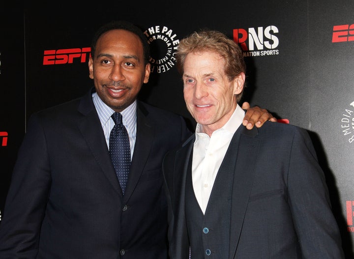 Sports commentators Stephen A. Smith, left, and Skip Bayless appear at a benefit event in New York City in 2014.