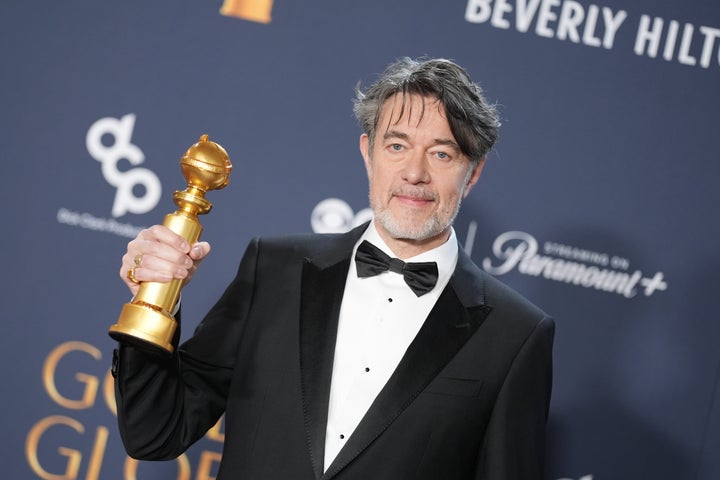 Screenwriter Peter Straughan holds a Golden Globe award for the film "Conclave."