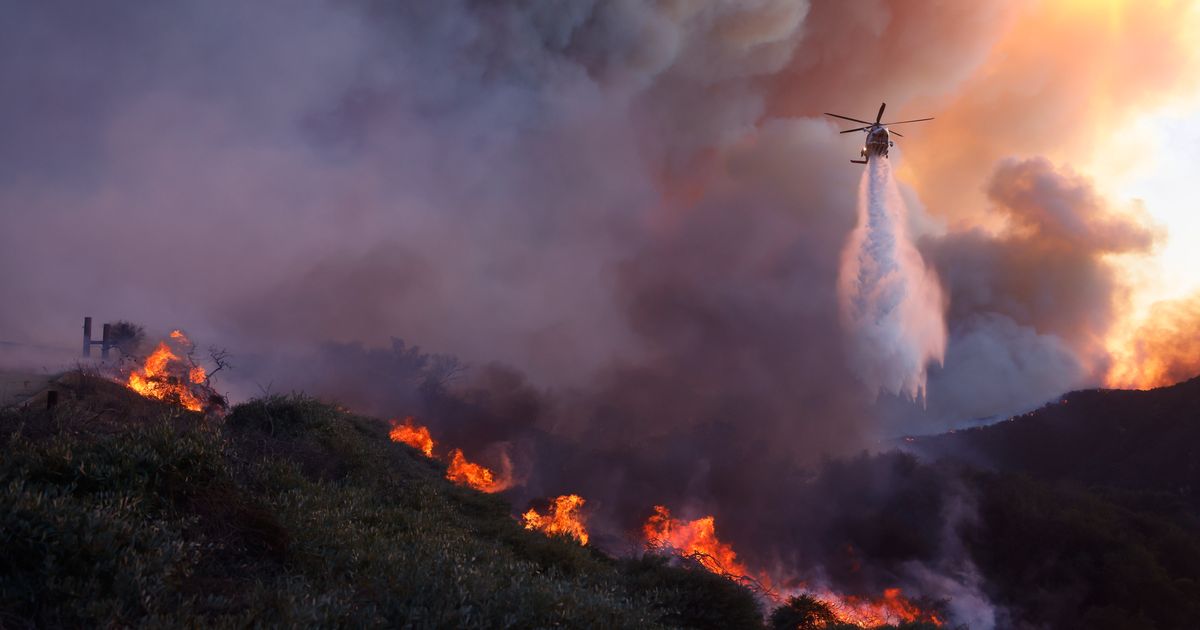 30,000 Los Angeles Residents Under Evacuation As Wildfire Whips Through Hillsides