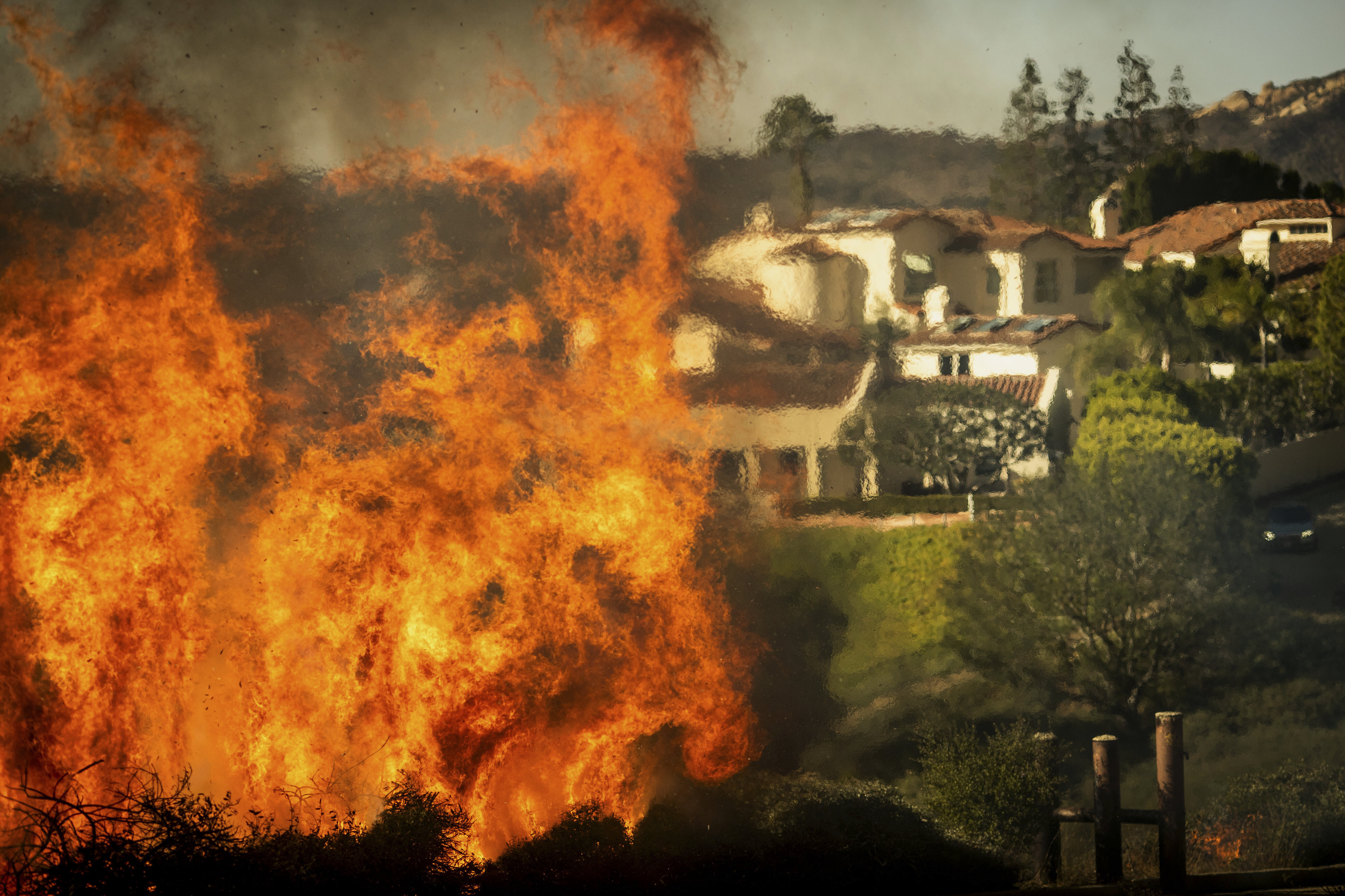 30,000 Los Angeles Residents Under Evacuation As Wildfire Whips Through Hillsides