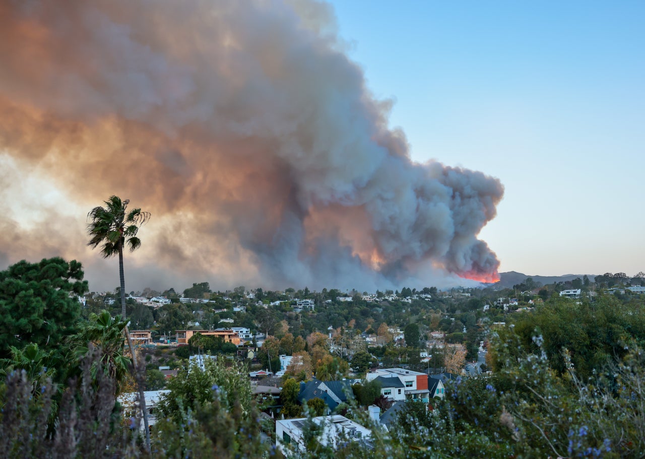 Smoke from the Palisades Fire fills the sky, as seen from the Pacific Palisades neighborhood of Los Angeles on Tuesday.