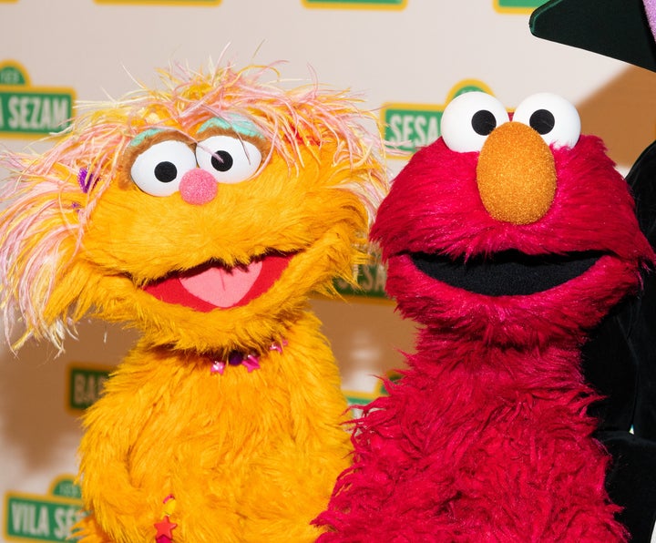 Zoe and Elmo at the Sesame Workshop's 16th Annual Benefit Gala in New York City. Elmo has a long feud with Zoe's pet rock, Rocco.