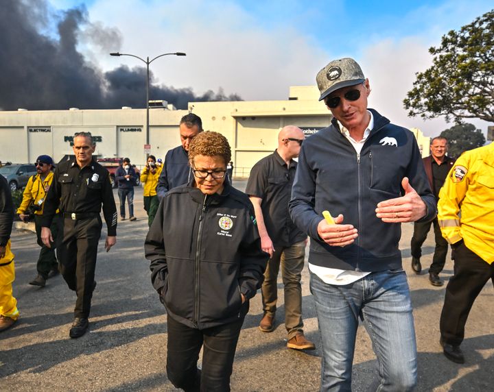 Los Angeles Mayor Karen Bass walks with California Governor Gavin Newsom while surveying damage during the Palisades Fire on Wednesday.