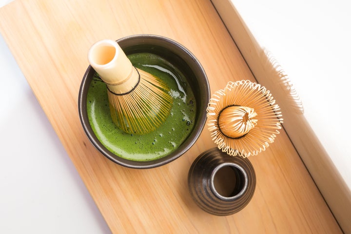 Matcha is made by whisking hot water and matcha powder with a bamboo whisk.