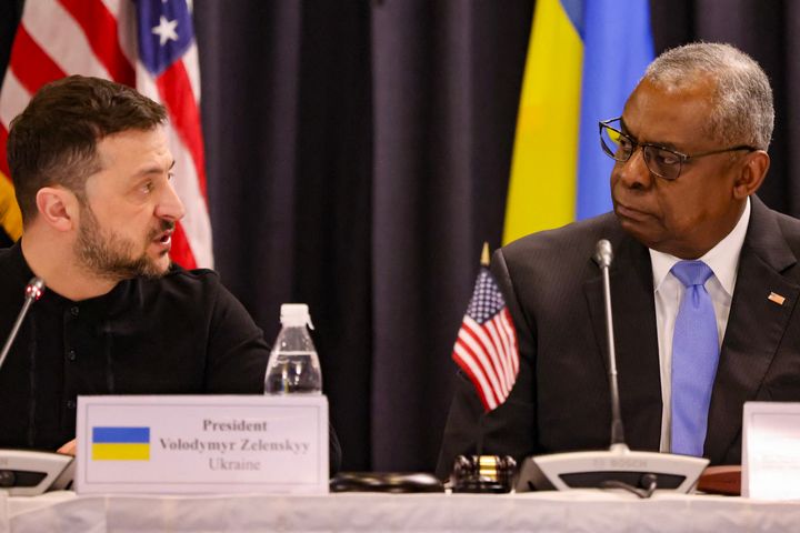 Ukraine's President Volodymyr Zelensky, left, and U.S. Secretary of Defence Lloyd Austin react during the opening of the Ukraine Defense Contact Group meeting at Ramstein Air Base, Germany, on Jan. 9, 2025.