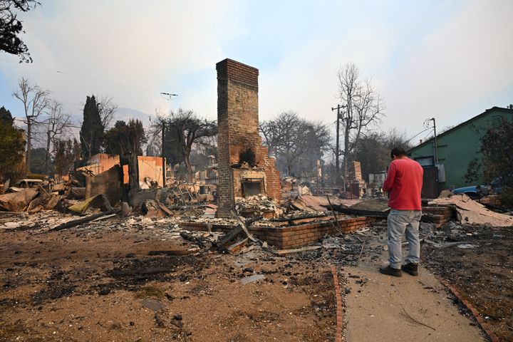 Residents inspect the rubble of their burnt houses after the Eaton wildfire tore through the area in Altadena, Los Angeles County, on Thursday.