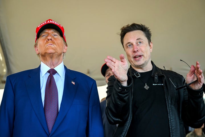 President-elect Donald Trump listens to Elon Musk