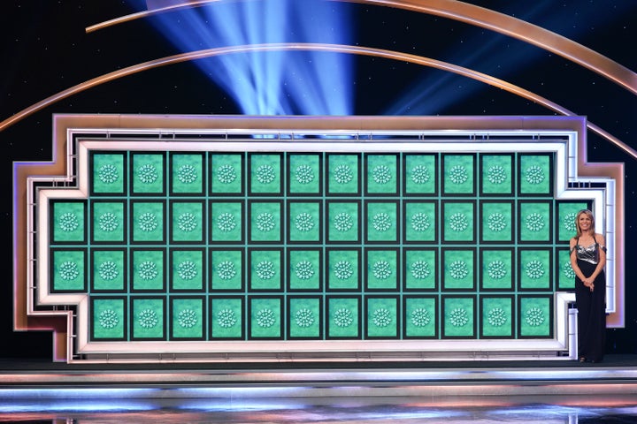 An image shows the puzzle board on "Celebrity Wheel of Fortune," a spinoff of the game show "Wheel of Fortune."