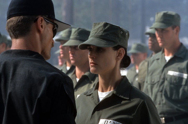 Demi Moore is stared down in a scene from the film "G.I. Jane," 1997. "With ‘Striptease,’ it was as if I had betrayed women, and with 'G.I. Jane,' it was as if I had betrayed men,” she said in an interview.