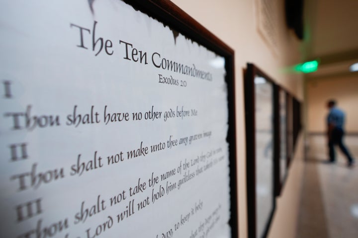 A copy of the Ten Commandments is posted along with other historical documents in a hallway of the Georgia Capitol, June 20, 2024, in Atlanta. (AP Photo/John Bazemore, File)