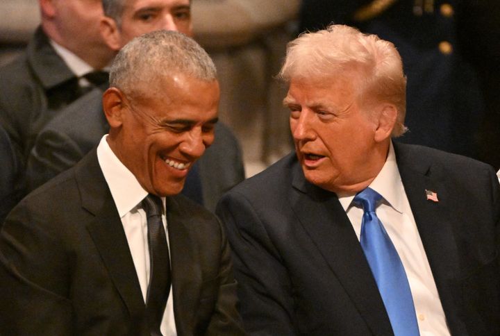 Former US President Barack Obama speaks with President-elect Donald Trump