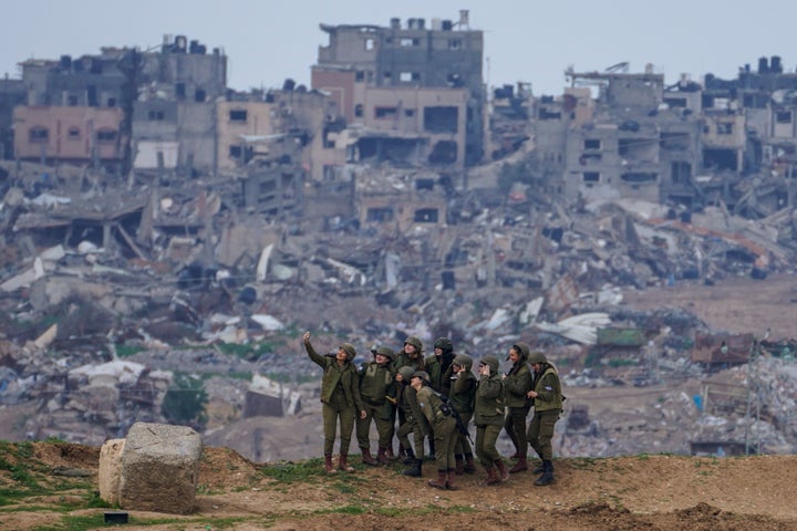 Female Israeli soldiers pose for a photo on the border between Gaza and southern Israel, on Monday, Feb. 19, 2024.