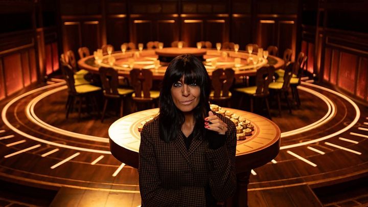 Claudia Winkleman in front of the famous Traitors roundtable.