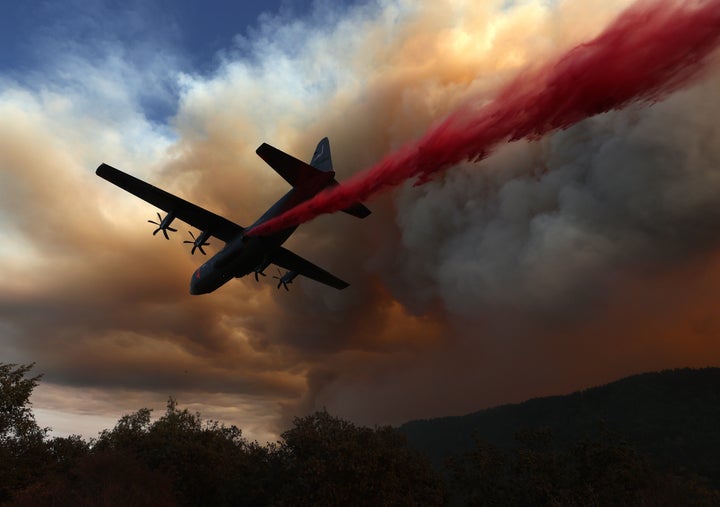 A C-130 aircraft drops retardant in Northern California in 2020.