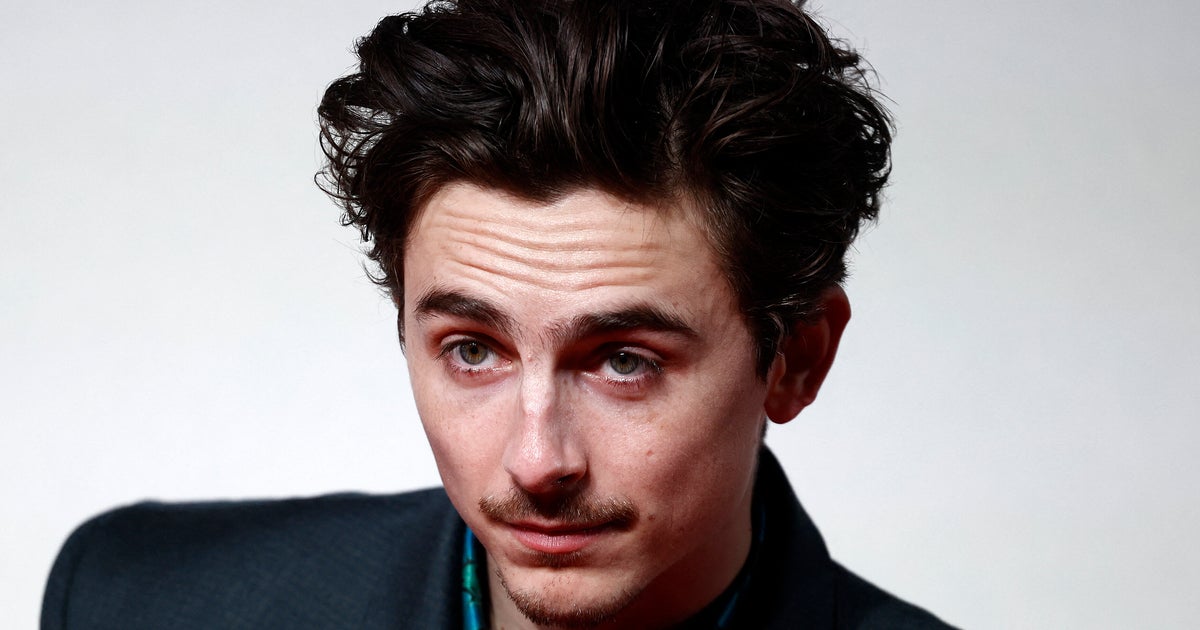 NextImg:Timothée Chalamet Continues Press Tour Antics As He Bikes Into Premiere