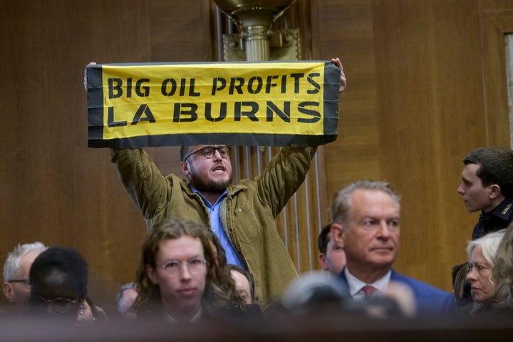 A protester interrupts Wright, Trump's nominee to be secretary of energy, as he testifies during a Senate Energy and Natural Resources Committee hearing for his pending confirmation on Capitol Hill, Wednesday, Jan. 15, 2025, in Washington.