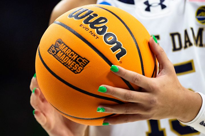 Notre Dame forward Natalija Marshall (15) prepares to shoot a free-throw with green painted nails with a Wilson EVO NXT basketball with March Madness branding on it during the second half of a first-round college basketball game against Kent State in the NCAA Tournament on March 23, 2024, in South Bend, Ind.