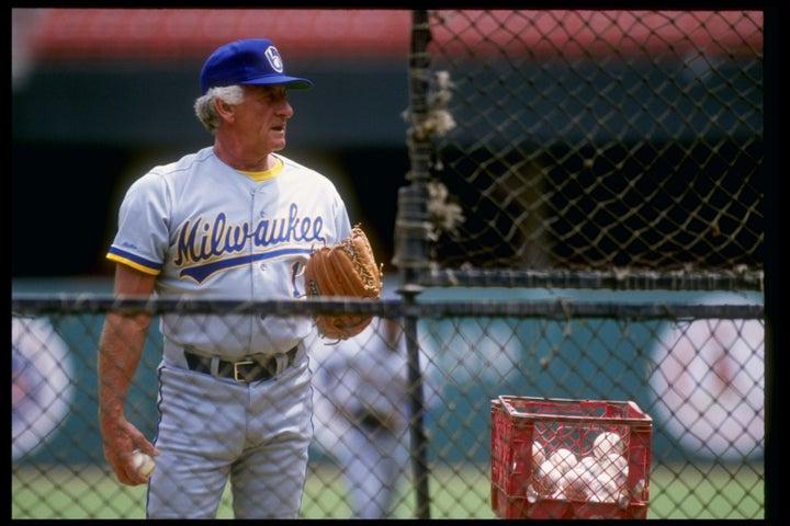 Former catcher Bob Uecker of the Milwaukee Brewers stands beside basket of baseballs. Mandatory Credit: Stephen Dunn /Allsport