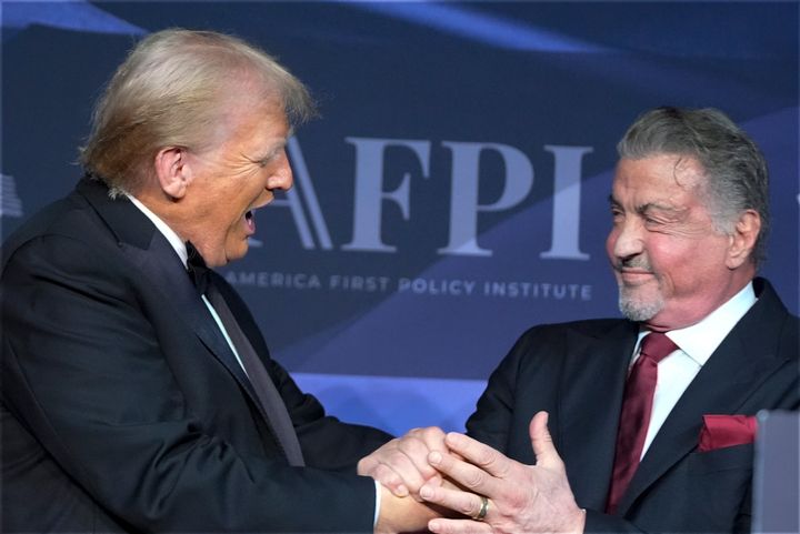 President-elect Donald Trump greets actor Sylvester Stallone during an America First Policy Institute gala at his Mar-a-Lago estate on Nov. 14, 2024.