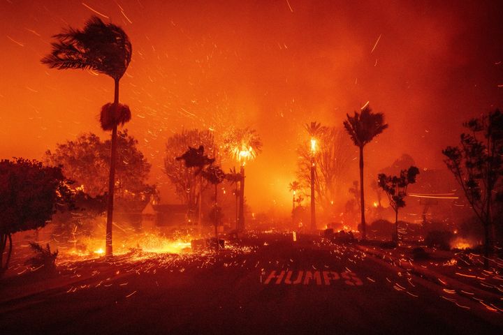 The Palisades Fire ravages a neighborhood amid high winds in the Pacific Palisades neighborhood of Los Angeles, on Jan. 7, 2025.