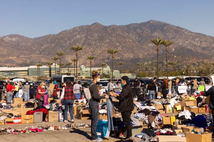 Volunteers sort donated goods at the Santa Anita Racetrack parking lot in Arcadia, California, on Jan. 14.