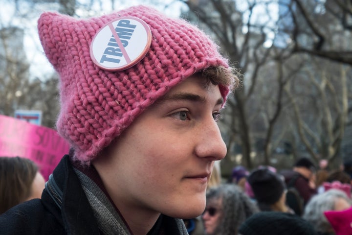 A demonstrator wears a pink hat and an anti-Trump button during the second annual Women's March in New York City on Jan. 20, 2018, one year after Trump's first inauguration.