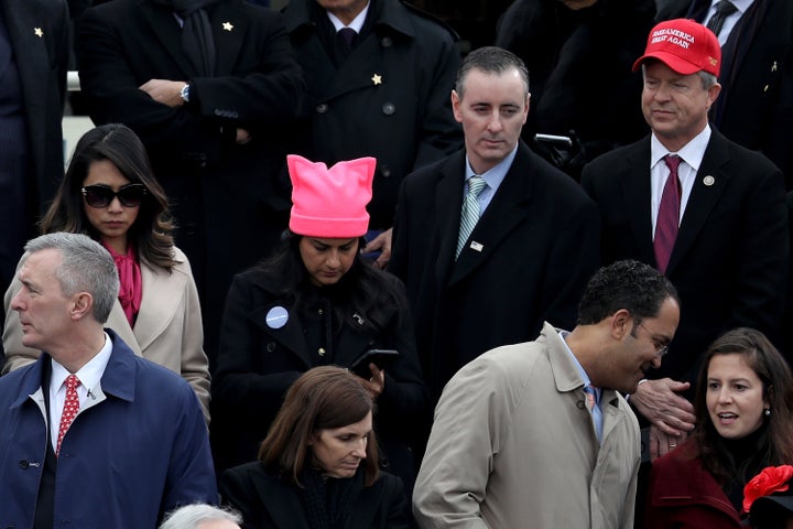 A woman wears a pink knit "pussy" hat among spectators at the U.S. Capitol on Jan. 20, 2017, at the first inauguration ceremony of Donald J. Trump.