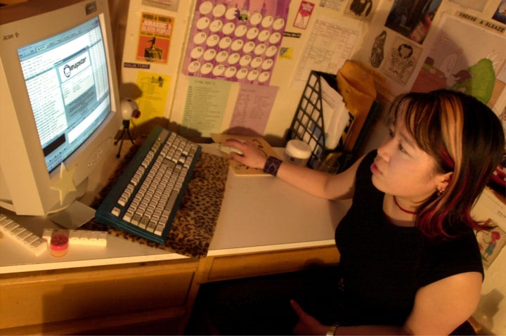 A New York University student downloads music from the Napster in 2001.