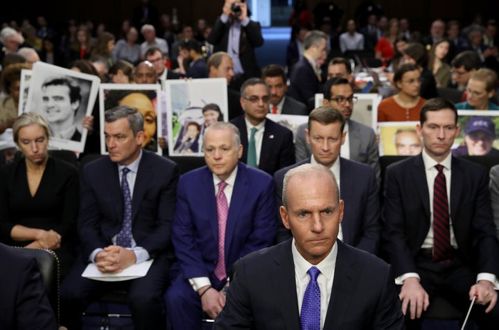 Dennis Muilenburg (foreground), president and CEO of the Boeing Company, sits at the witness table at a Senate committee hearing in front of the family members of people who died aboard Ethiopian Airlines Flight 302, on Oct. 29, 2019.