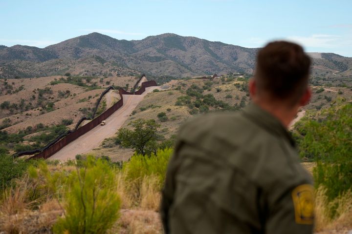 Border patrol agent Pete Bidegain looks from a hilltop on the U.S. side of the U.S.-Mexico border in Nogales, Arizona, on June 25, 2024. 