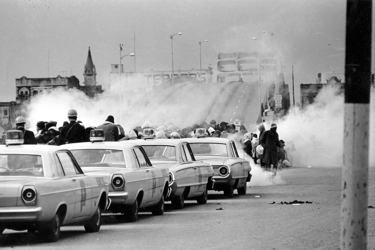 Tear gas fills the air as state troopers, ordered by Alabama Gov. George Wallace, break up a march at the Edmund Pettus Bridge in Selma, Alabama, on March 7, 1965, on what became known as Bloody Sunday.