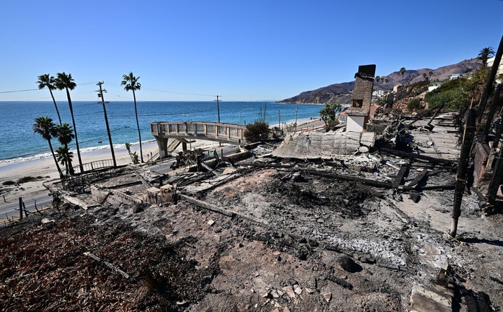 A charred chimney is all that remains standing Thursday at a fire-ravaged oceanfront home in the Pacific Palisades neighborhood of Los Angeles.