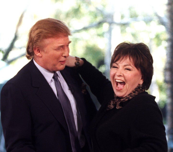 Donald Trump embraces Roseanne Barr during a taping of her talk show in Manhattan on November 17, 1998.